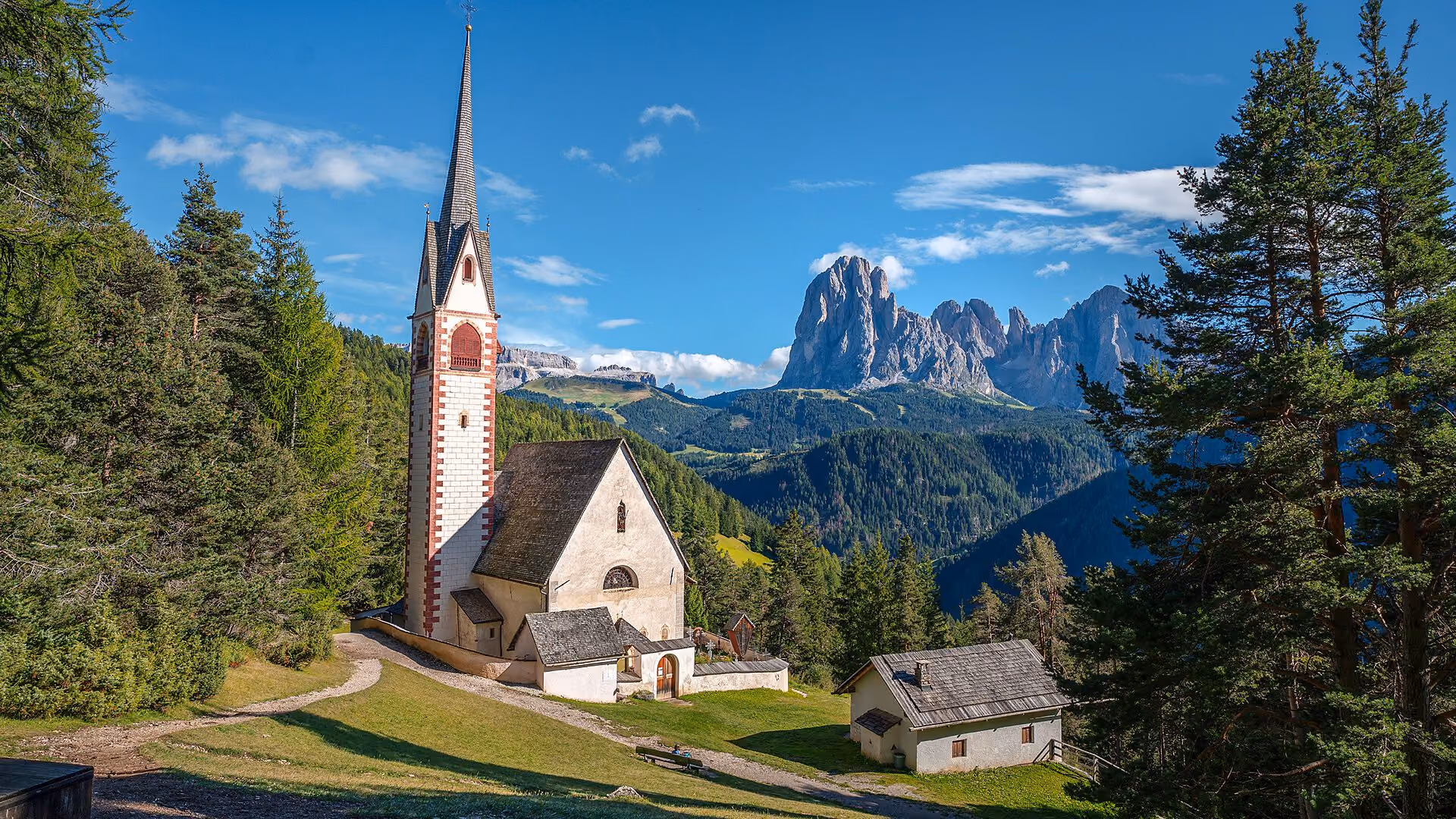 The church of San Giacomo on its meadow, Sassolungo behind