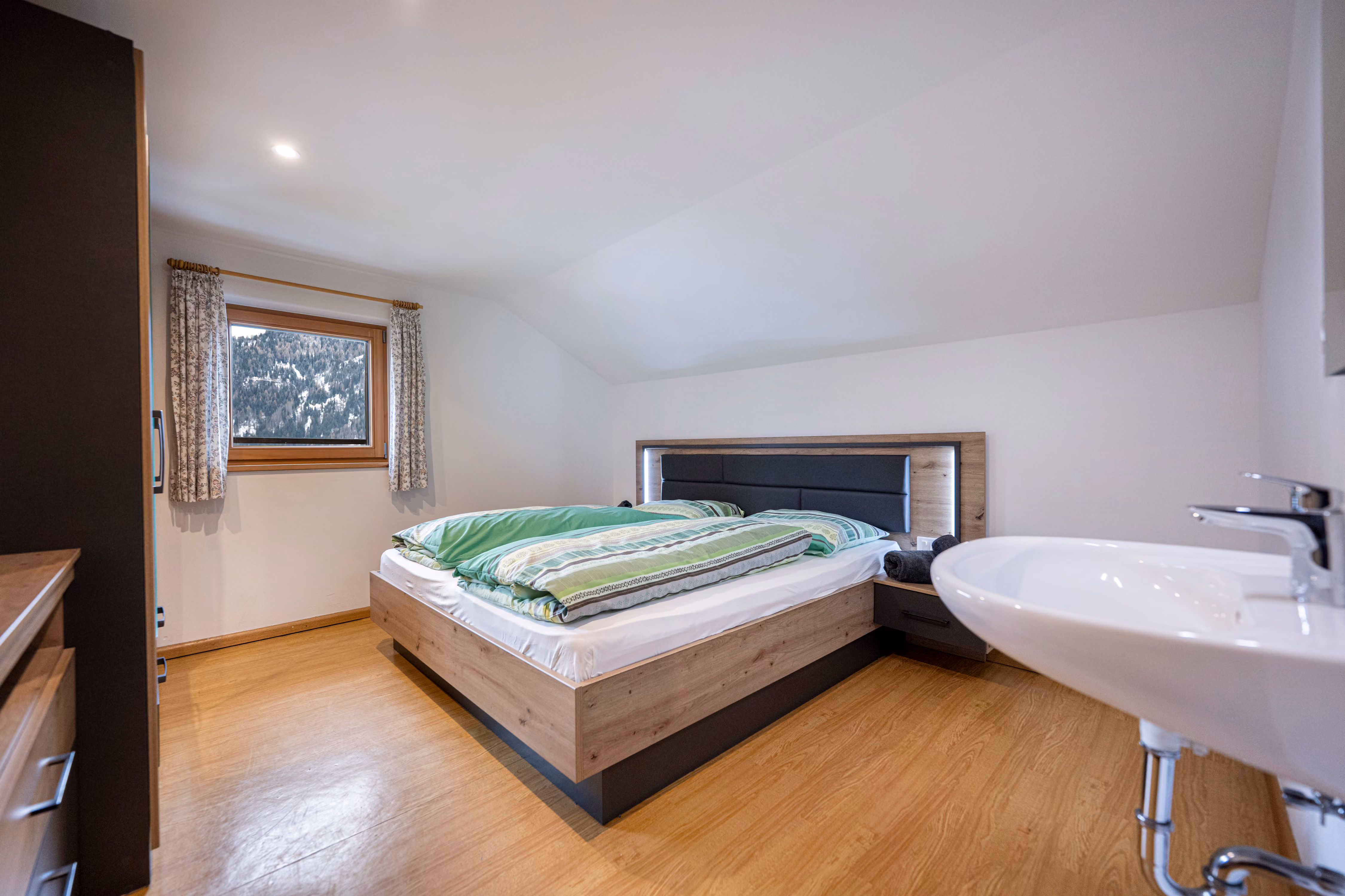 The bedroom under the roof slope