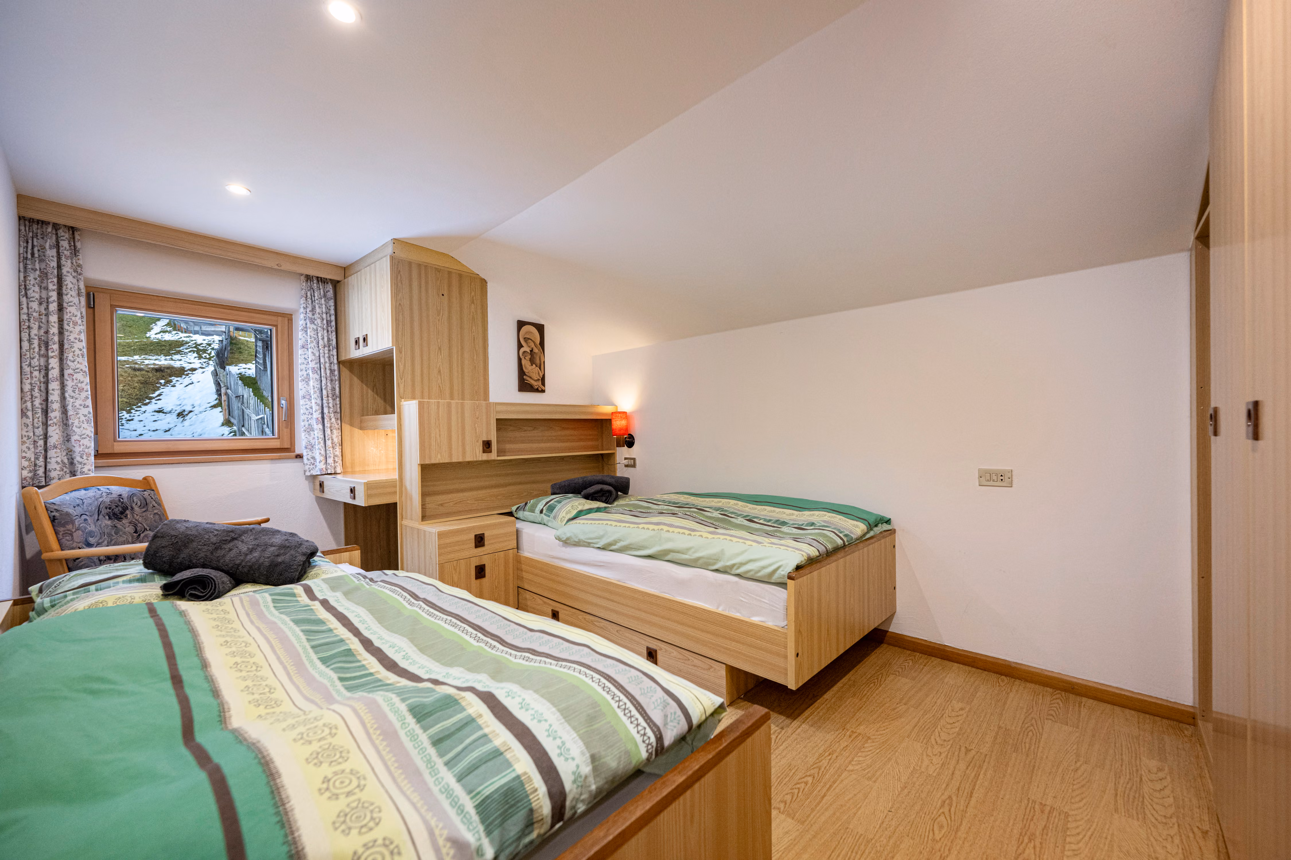 The second bedroom, two single beds under the slope